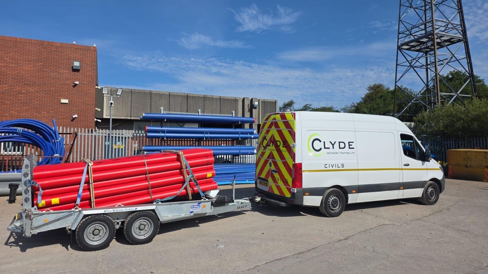 Clyde Network Testing van and trailer loaded with red HV ducting at the yard